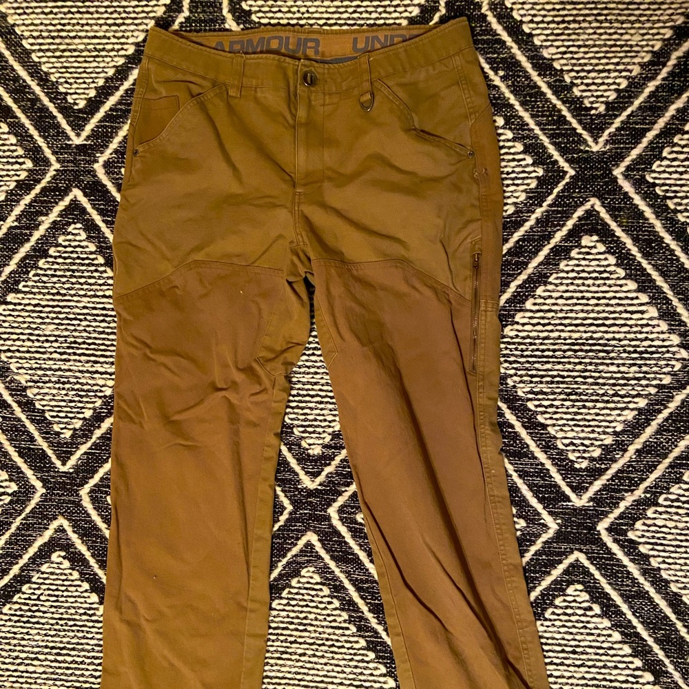 Under Armor pants. Small tear and stain on right pocket, stain on back pocket